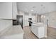 Stylish kitchen with white cabinets, granite countertops, and stainless steel appliances at 665 Look Lively Ct, Henderson, NV 89011