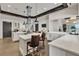 Modern kitchen with white cabinetry, a large island, stainless steel appliances, and stylish lighting at 665 Look Lively Ct, Henderson, NV 89011