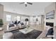 Inviting living room featuring an open floor plan, modern decor, and a cozy fireplace at 665 Look Lively Ct, Henderson, NV 89011