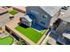 This bird's-eye view showcases a well-designed backyard, complete with putting green, hot tub and manicured lawn at 70 Pikiariki Ct, Las Vegas, NV 89183