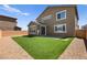 Private backyard offers a small patio, turf, and low-maintenance landscaping at 70 Pikiariki Ct, Las Vegas, NV 89183