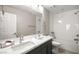 Bright bathroom showcasing a double sink vanity, tiled shower/tub combo, and a modern design at 70 Pikiariki Ct, Las Vegas, NV 89183
