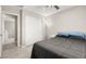 View of a bedroom with closet, light gray walls, tiled floor, and an airy feel at 70 Pikiariki Ct, Las Vegas, NV 89183