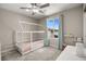 Inviting bedroom with a creative house bed, soft carpet, and a sunlit window at 70 Pikiariki Ct, Las Vegas, NV 89183