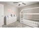 Cozy bedroom featuring a house bed, soft carpet, and dresser for ample storage at 70 Pikiariki Ct, Las Vegas, NV 89183