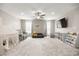 Large bonus room featuring plush carpet, a ceiling fan, and plenty of space for seating and play areas at 70 Pikiariki Ct, Las Vegas, NV 89183