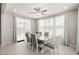Bright dining room featuring a marble table set and large windows with sheer curtains, creating a welcoming atmosphere at 70 Pikiariki Ct, Las Vegas, NV 89183