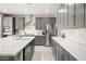 Well-appointed kitchen with stainless steel appliances, ample counter space, and stylish gray cabinets at 70 Pikiariki Ct, Las Vegas, NV 89183