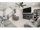 Cozy living room boasts a fireplace with marble surround, recessed lighting, modern ceiling fan, and comfortable seating at 70 Pikiariki Ct, Las Vegas, NV 89183