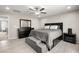 Comfortable main bedroom features stylish furniture and an adjacent bathroom, offering a private and serene retreat at 70 Pikiariki Ct, Las Vegas, NV 89183