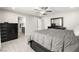 Comfortable main bedroom featuring wood-look tile floors and an adjacent bathroom, offering a private and serene retreat at 70 Pikiariki Ct, Las Vegas, NV 89183