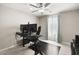 Well-lit office space, tiled floor, large windows, and functional work space at 70 Pikiariki Ct, Las Vegas, NV 89183