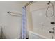 This bathroom features a shower and tub combination at 702 Carlitos Ave, North Las Vegas, NV 89031