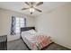Comfortable bedroom featuring carpet, a double bed, and a ceiling fan at 702 Carlitos Ave, North Las Vegas, NV 89031