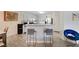 Open kitchen design with breakfast bar and modern appliances at 702 Carlitos Ave, North Las Vegas, NV 89031