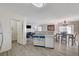 Open concept kitchen and living area with modern amenities at 702 Carlitos Ave, North Las Vegas, NV 89031