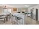 View of the eat-in kitchen with breakfast bar at 702 Carlitos Ave, North Las Vegas, NV 89031