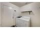 Practical laundry room with modern washer and dryer at 702 Carlitos Ave, North Las Vegas, NV 89031
