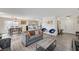 Open concept floor plan showcasing the living room and dining area at 702 Carlitos Ave, North Las Vegas, NV 89031