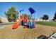 A vibrant playground area with colorful equipment, offering a fun and engaging space for children at 702 Carlitos Ave, North Las Vegas, NV 89031