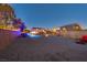 Spacious backyard with a sparkling pool, gravel landscaping, and privacy fencing at 7736 Tioga Ridge Ct, Las Vegas, NV 89117