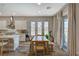 Bright dining area with backyard views and access, adjacent to the modern kitchen at 7736 Tioga Ridge Ct, Las Vegas, NV 89117
