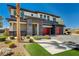 Exterior view showcasing the desert landscaping and brick accents at 7736 Tioga Ridge Ct, Las Vegas, NV 89117