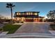 Gorgeous two-story house with a three-car garage and mature landscaping at 7736 Tioga Ridge Ct, Las Vegas, NV 89117