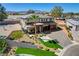 Two-story home featuring manicured landscaping, a stone driveway, and a two-car garage at 7736 Tioga Ridge Ct, Las Vegas, NV 89117