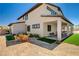 The back of the home features a covered patio and an outdoor table at 7736 Tioga Ridge Ct, Las Vegas, NV 89117