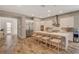 Bright kitchen with large island, modern stainless appliances, and wood-look tile flooring at 7736 Tioga Ridge Ct, Las Vegas, NV 89117