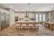 Open-concept kitchen boasts a spacious island, stainless appliances, and adjacent dining area at 7736 Tioga Ridge Ct, Las Vegas, NV 89117