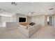 The spacious living room features a comfortable sectional and media center at 7736 Tioga Ridge Ct, Las Vegas, NV 89117