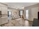 Open-concept living space boasts wood-look tile floors and neutral tones at 7736 Tioga Ridge Ct, Las Vegas, NV 89117
