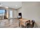 Cozy living space with table, chairs, tv and dresser, bathed in natural light at 7736 Tioga Ridge Ct, Las Vegas, NV 89117