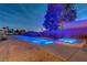 Stunning pool and spa combination with modern lighting and desert landscaping at 7736 Tioga Ridge Ct, Las Vegas, NV 89117