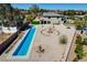 Contemporary home featuring an inground pool with gravel landscaping and mountain views at 7736 Tioga Ridge Ct, Las Vegas, NV 89117