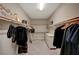 Spacious walk-in closet with multiple shelves, hanging rods, and drawers offers ample storage at 7736 Tioga Ridge Ct, Las Vegas, NV 89117