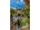 Backyard featuring a pool, lounge chairs, and lush landscaping, ideal for relaxation and outdoor living at 7988 Pinnacle Peak Ave, Las Vegas, NV 89113