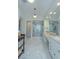 Bright and spacious bathroom with dual vanities, glass shower, and modern fixtures at 7988 Pinnacle Peak Ave, Las Vegas, NV 89113