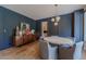 Elegant dining room with wood floors, modern lighting, and stylish decor at 7988 Pinnacle Peak Ave, Las Vegas, NV 89113
