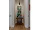 Hallway niche featuring artwork, decor and wood flooring at 7988 Pinnacle Peak Ave, Las Vegas, NV 89113