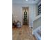 Decorated hallway with niche, artwork, and wood flooring at 7988 Pinnacle Peak Ave, Las Vegas, NV 89113