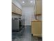 Functional laundry room with cabinetry, countertop space, and modern washer and dryer at 7988 Pinnacle Peak Ave, Las Vegas, NV 89113