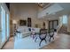 Bright living room with high ceilings, a modern staircase, and wood flooring at 7988 Pinnacle Peak Ave, Las Vegas, NV 89113