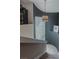 Staircase with gray walls and a unique block window providing natural light at 7988 Pinnacle Peak Ave, Las Vegas, NV 89113