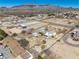Wide aerial view showing the house, barn, and surrounding landscape at 861 Mcmurray Dr, Pahrump, NV 89060