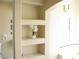 Bright bathroom with built in shelving next to a soaking tub at 861 Mcmurray Dr, Pahrump, NV 89060