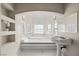 Elegant bathroom with a soaking tub and natural light at 861 Mcmurray Dr, Pahrump, NV 89060