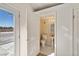 Secondary bathroom featuring pedestal sink, tile floors, and ample natural light at 861 Mcmurray Dr, Pahrump, NV 89060